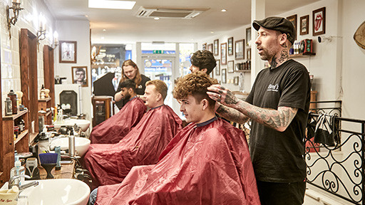 Bond's Barbershop Bournemouth - 3 Barbers cutting hair