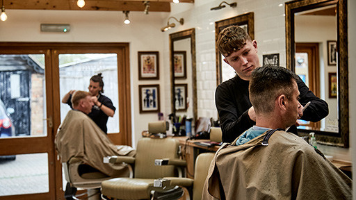 Bond's Barbershop Lymington - 2 barbers cutting hair