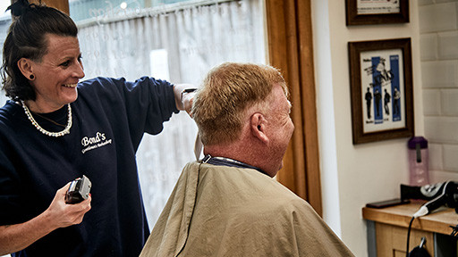 Bond's Barbershop Lymington - Barber cutting hair