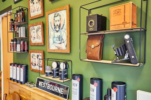 Bond's Barbershop Westbourne - Products and pictures on wall