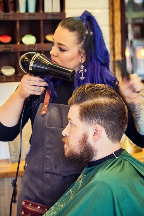 Bond's Barbershop Westbourne - barber drying a customer's hair